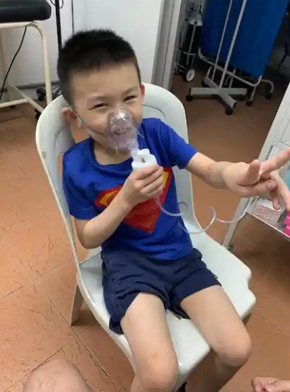 Child using a nebulizer